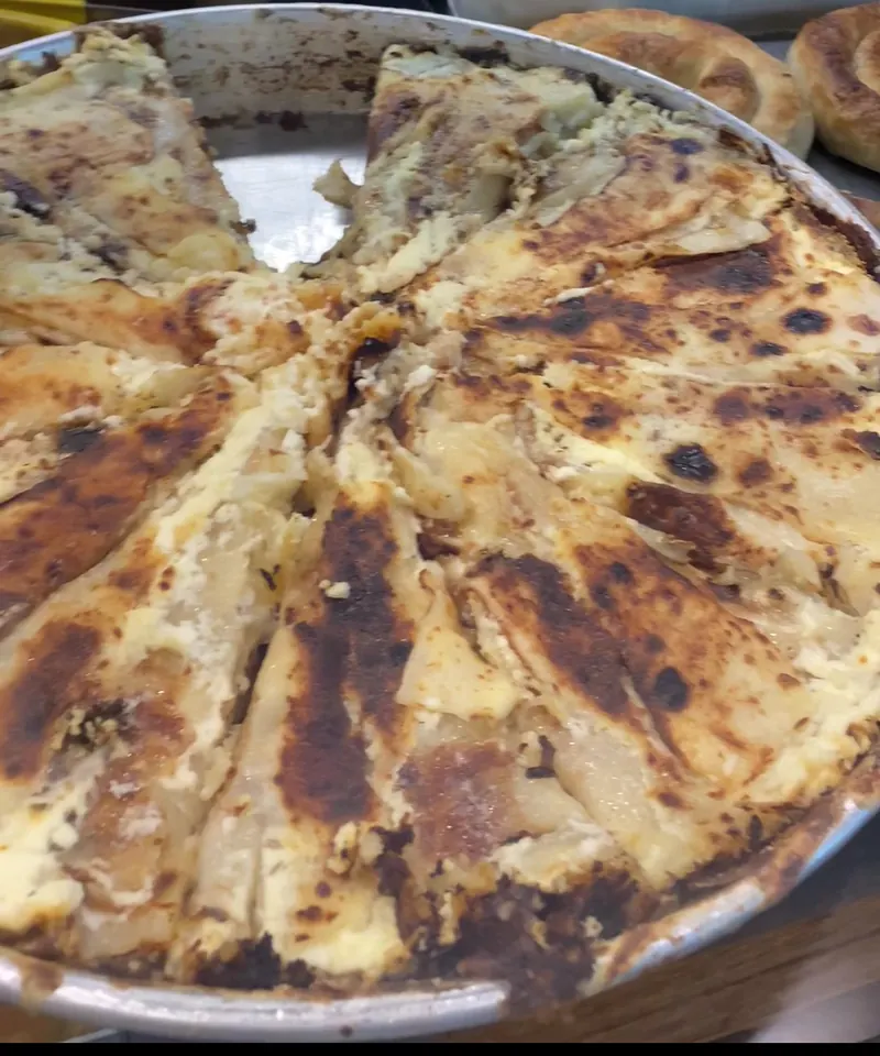 A whole fli in its round pan, cut into slices