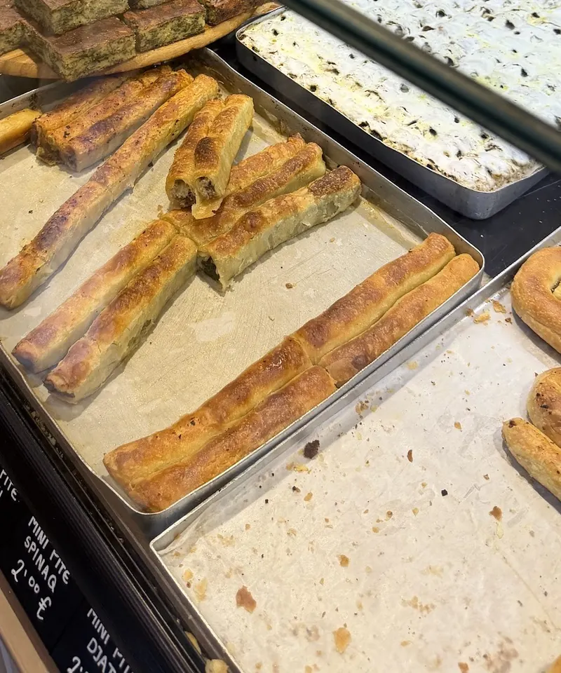 Long pite rolls on trays at the counter