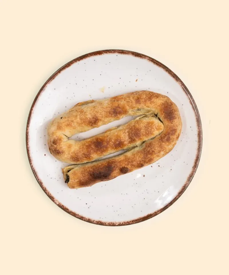 A mini pite coiled on a plate