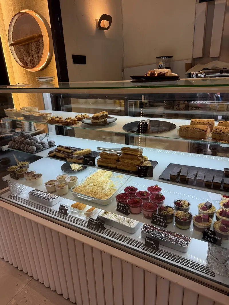 The dessert counter, with trileçe, éclairs and cups